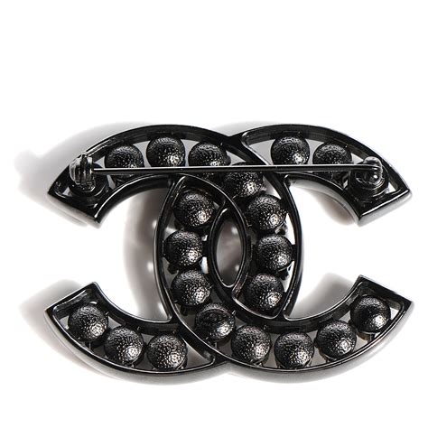 chanel brooch on black formal dress|chanel lapel brooch.